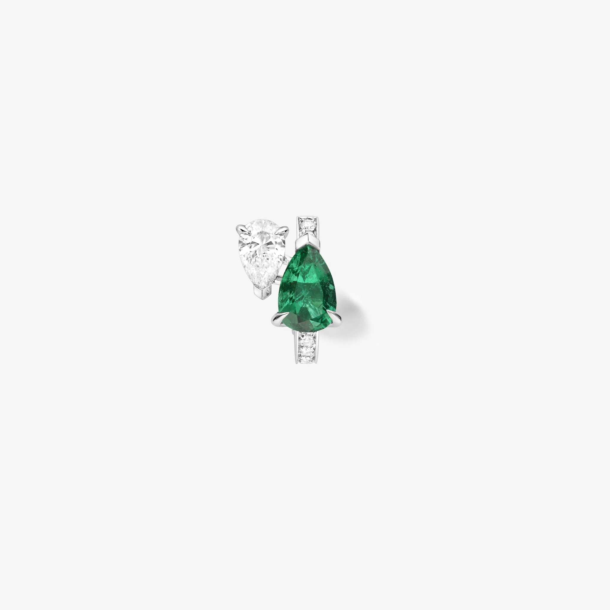 Serti sur Vide earring set with 1 diamond and 1 emerald